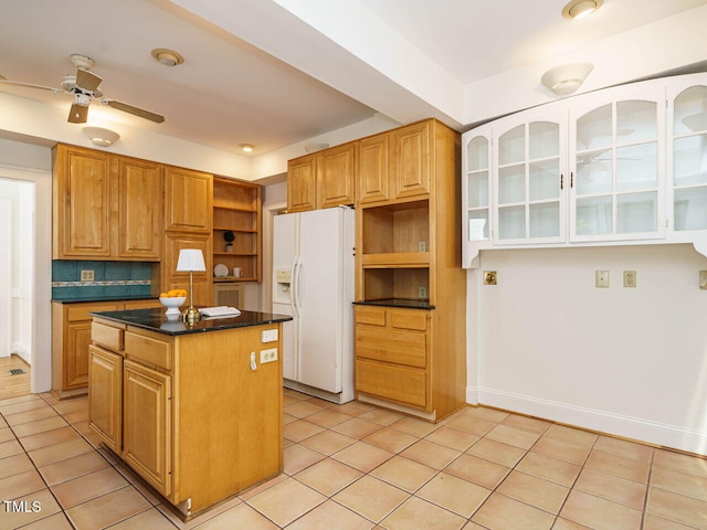 907 W Johnson St, Raleigh, NC 27605 - kitchen featuring white refrigerator with ice dispenser, open shelves, a kitchen island, and light tile patterned flooring