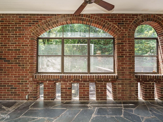 907 W Johnson St, Raleigh, NC 27605 - detailed view of ornamental molding, brick wall, and ceiling fan
