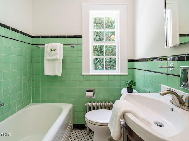 907 W Johnson St, Raleigh, NC 27605 - bathroom featuring tile walls, radiator heating unit, wainscoting, and vanity