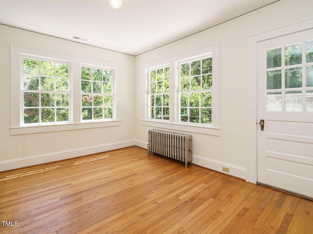 907 W Johnson St, Raleigh, NC 27605 - spare room with radiator and light wood finished floors