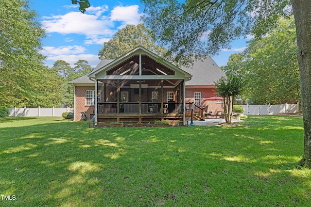 102 Sevendales Dr, Goldsboro, NC 27534 - back of property featuring brick siding, a sunroom, and ceiling fan