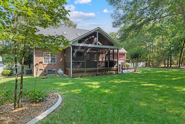 102 Sevendales Dr, Goldsboro, NC 27534 - rear view of property featuring a sunroom, central air condition unit, and brick siding