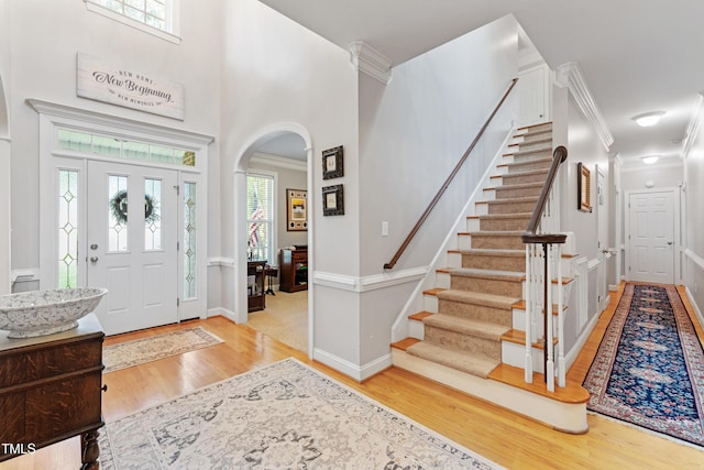 102 Sevendales Dr, Goldsboro, NC 27534 - foyer with wood finished floors, arched walkways, crown molding, stairway, and baseboards