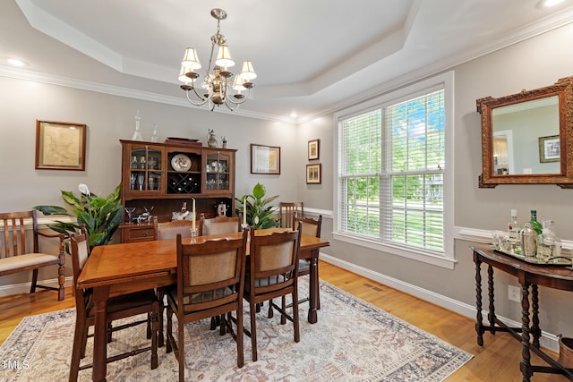 102 Sevendales Dr, Goldsboro, NC 27534 - dining room with a tray ceiling, a chandelier, light wood-type flooring, ornamental molding, and recessed lighting