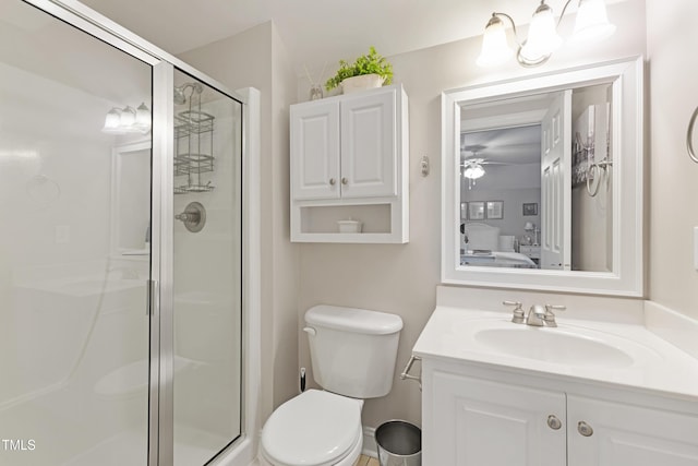 102 Sevendales Dr, Goldsboro, NC 27534 - bathroom with a stall shower, vanity, toilet, and a ceiling fan