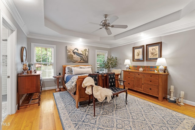 102 Sevendales Dr, Goldsboro, NC 27534 - bedroom featuring a raised ceiling, multiple windows, light wood-style flooring, crown molding, and recessed lighting