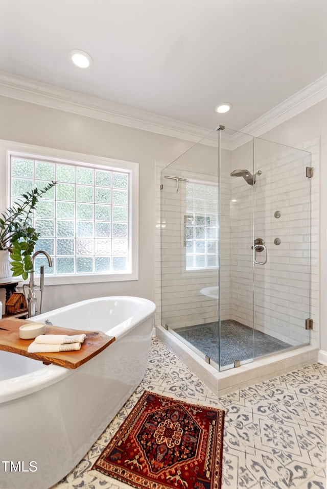 102 Sevendales Dr, Goldsboro, NC 27534 - bathroom with a freestanding bath, tile patterned flooring, a stall shower, ornamental molding, and recessed lighting