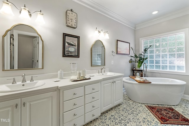 102 Sevendales Dr, Goldsboro, NC 27534 - full bath featuring double vanity, a soaking tub, tile patterned flooring, ornamental molding, and recessed lighting