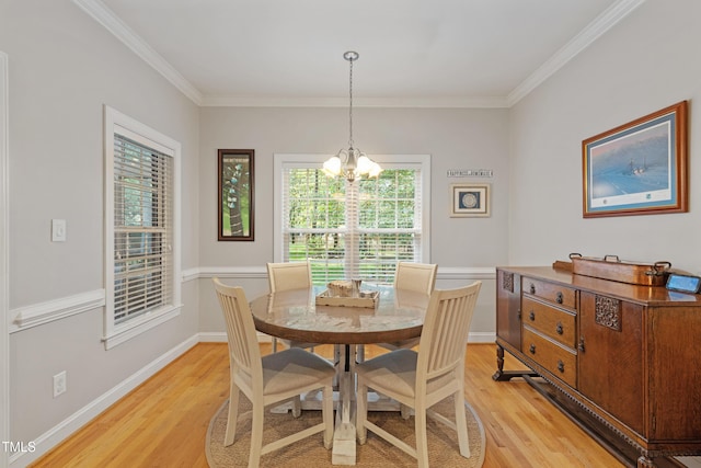 102 Sevendales Dr, Goldsboro, NC 27534 - dining space featuring light wood-type flooring, a chandelier, crown molding, and baseboards
