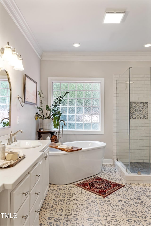 102 Sevendales Dr, Goldsboro, NC 27534 - bathroom with vanity, a stall shower, a freestanding tub, crown molding, and tile patterned floors
