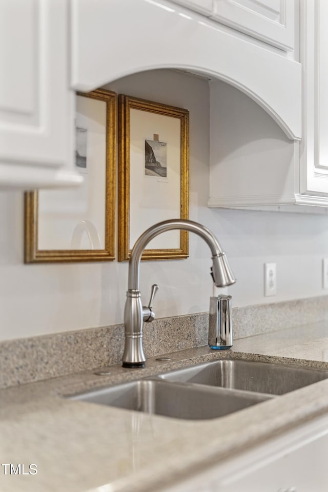 102 Sevendales Dr, Goldsboro, NC 27534 - kitchen view of a sink and white cabinetry