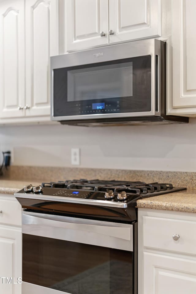 102 Sevendales Dr, Goldsboro, NC 27534 - kitchen featuring appliances with stainless steel finishes, white cabinets, and light countertops