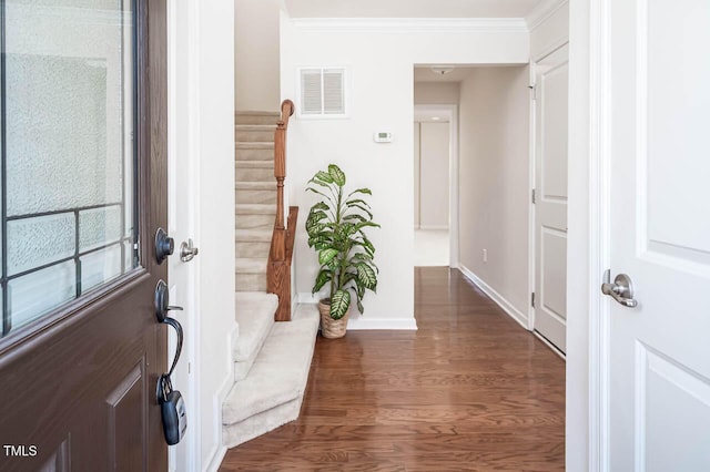 732 Suffield Way, Cary, NC 27519 - foyer featuring stairway, dark wood-style floors, and ornamental molding