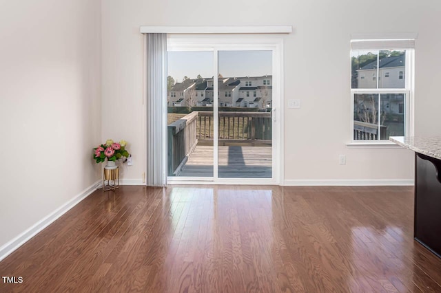 732 Suffield Way, Cary, NC 27519 - unfurnished dining area featuring wood finished floors and a residential view