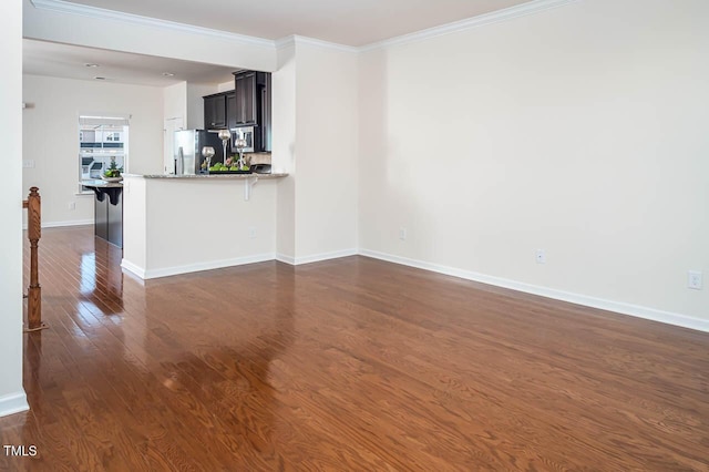 732 Suffield Way, Cary, NC 27519 - unfurnished living room with dark wood finished floors and ornamental molding