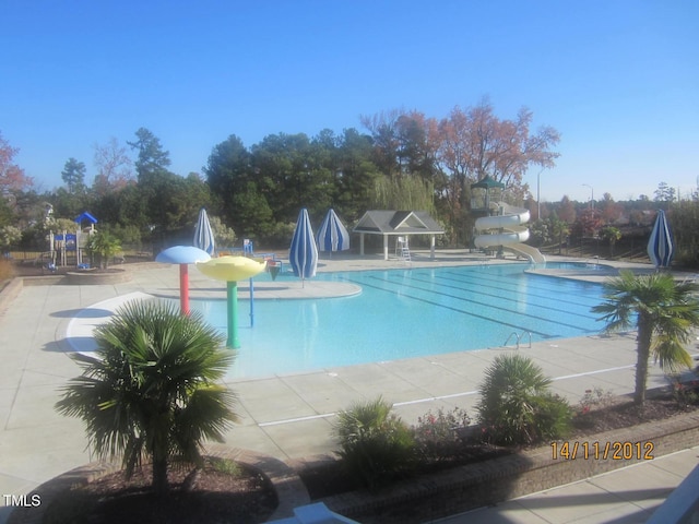 732 Suffield Way, Cary, NC 27519 - community pool featuring a water slide and a water play area