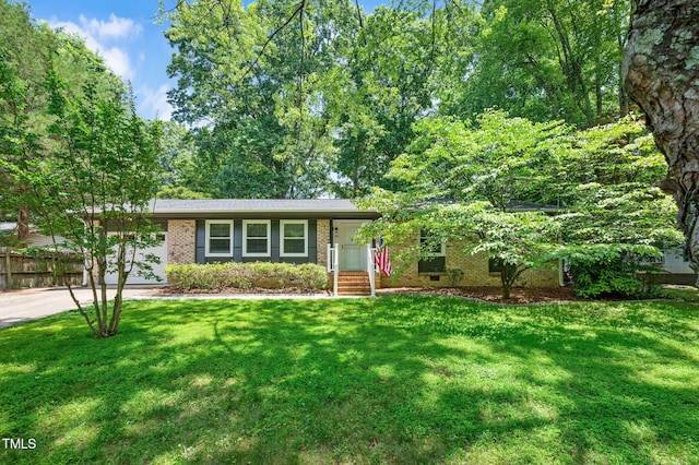 202 Howland Ave, Cary, NC 27513 - view of front of home with brick siding and concrete driveway