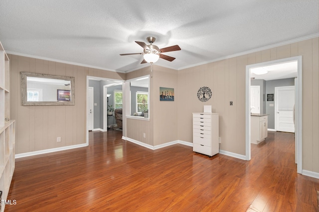 202 Howland Ave, Cary, NC 27513 - unfurnished room with wood finished floors, crown molding, a ceiling fan, and a textured ceiling