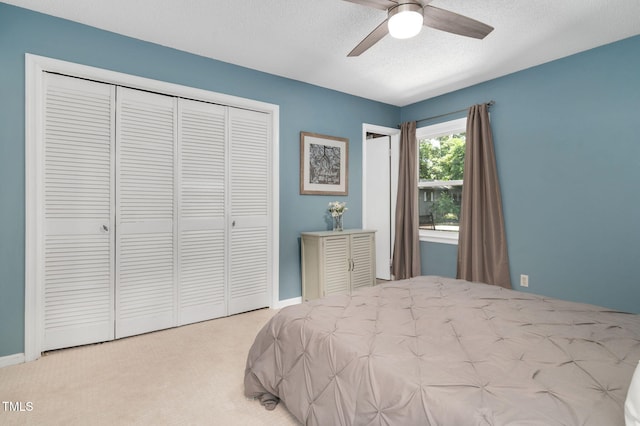 202 Howland Ave, Cary, NC 27513 - bedroom featuring a closet, carpet, a ceiling fan, and a textured ceiling