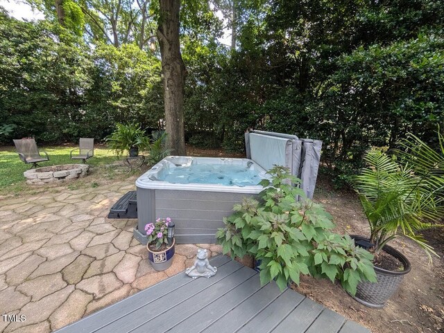 202 Howland Ave, Cary, NC 27513 - wooden deck featuring an outdoor fire pit, a hot tub, and a patio area