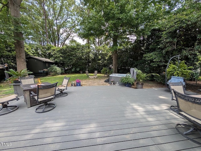 202 Howland Ave, Cary, NC 27513 - wooden deck with outdoor dining space, a fire pit, and view of scattered trees