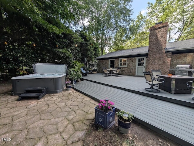 202 Howland Ave, Cary, NC 27513 - view of patio with a hot tub, a deck, outdoor dining space, a fire pit, and area for grilling