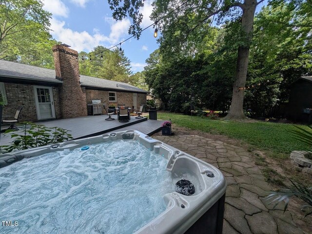202 Howland Ave, Cary, NC 27513 - view of pool with a hot tub, a patio, a wooden deck, and area for grilling