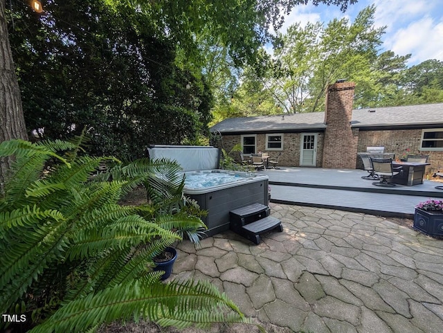 202 Howland Ave, Cary, NC 27513 - view of patio / terrace featuring a hot tub, a wooden deck, and outdoor dining space