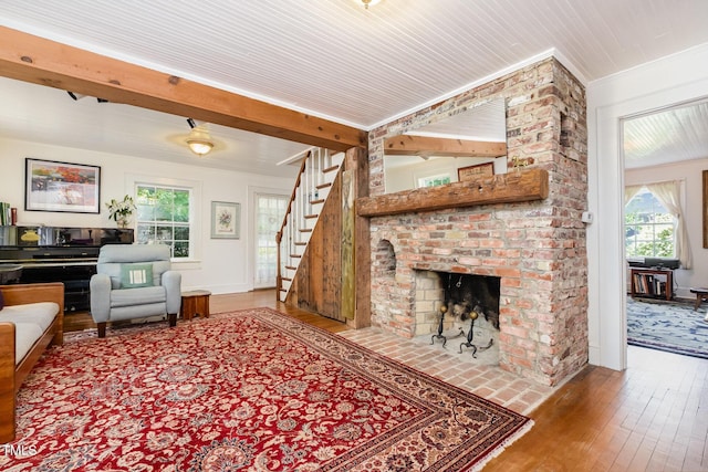 108 High St, Carrboro, NC 27510 - living room with hardwood / wood-style flooring, a brick fireplace, and stairway