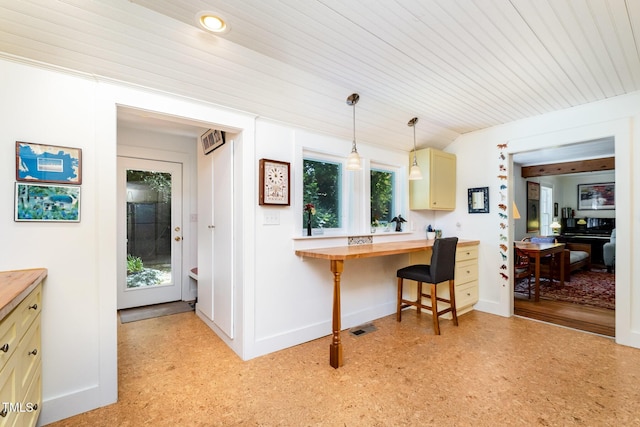 108 High St, Carrboro, NC 27510 - kitchen with butcher block countertops, an office area, pendant lighting, vaulted ceiling, and light flooring