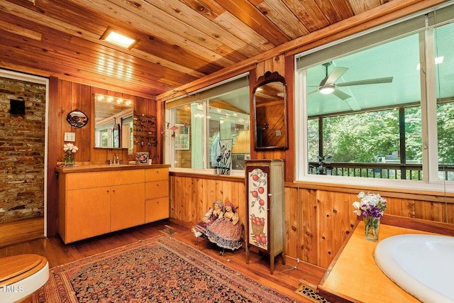 108 High St, Carrboro, NC 27510 - bar with plenty of natural light, wood walls, wooden ceiling, wood finished floors, and a ceiling fan