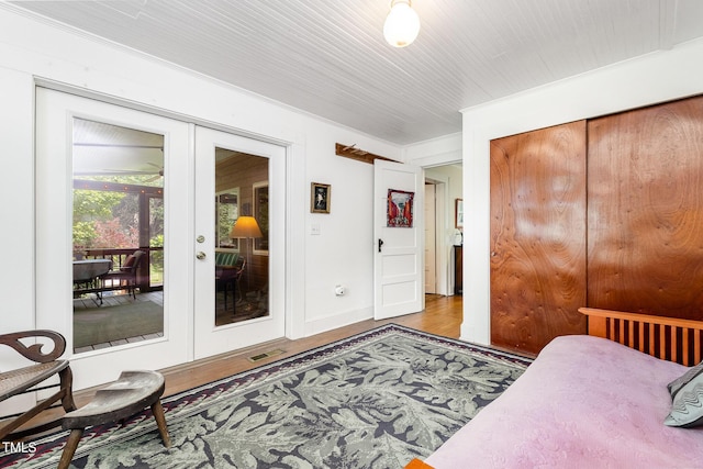 108 High St, Carrboro, NC 27510 - bedroom featuring french doors, access to exterior, and wood finished floors