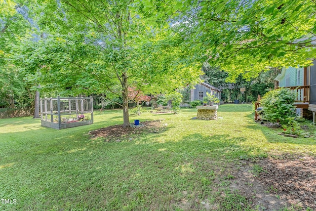 108 High St, Carrboro, NC 27510 - view of grassy yard featuring a garden