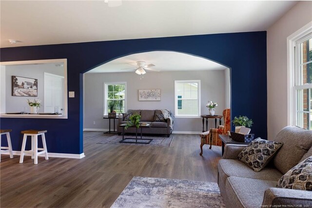 108 Pine St, Dunn, NC 28334 - living area with arched walkways, wood finished floors, and ceiling fan