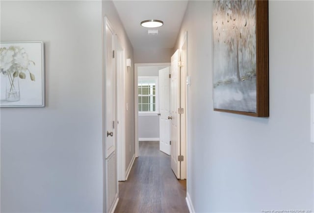 108 Pine St, Dunn, NC 28334 - corridor with dark wood finished floors and baseboards