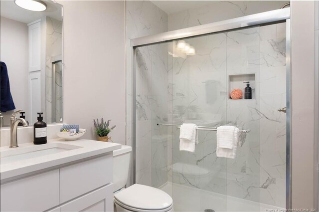108 Pine St, Dunn, NC 28334 - full bath with toilet, vanity, and a marble finish shower