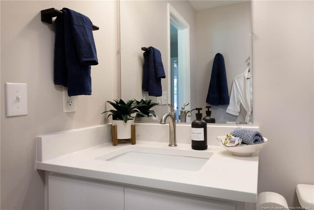 108 Pine St, Dunn, NC 28334 - half bath featuring vanity and toilet