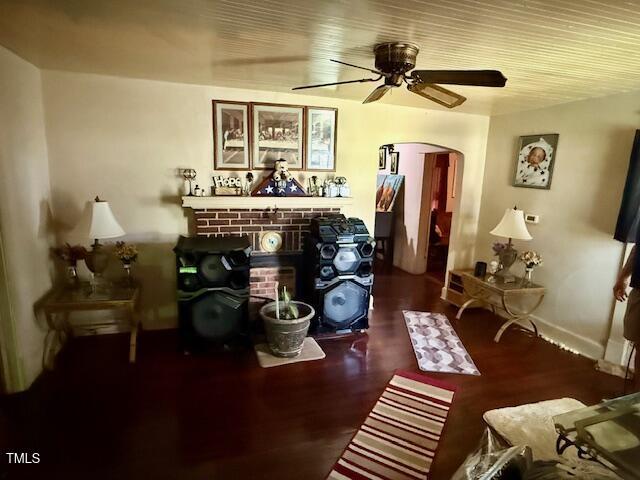 981 Leasburg Rd, Roxboro, NC 27573 - living area featuring arched walkways, ceiling fan, and wood finished floors