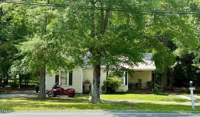 981 Leasburg Rd, Roxboro, NC 27573 - obstructed view of property with a front yard