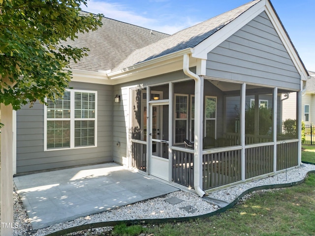 427 Cedar Pond Ct, Knightdale, NC 27545 - rear view of house featuring a shingled roof, a sunroom, and a patio