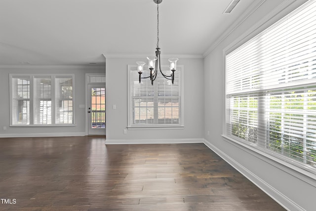 427 Cedar Pond Ct, Knightdale, NC 27545 - unfurnished dining area with a chandelier, plenty of natural light, ornamental molding, and dark wood-type flooring