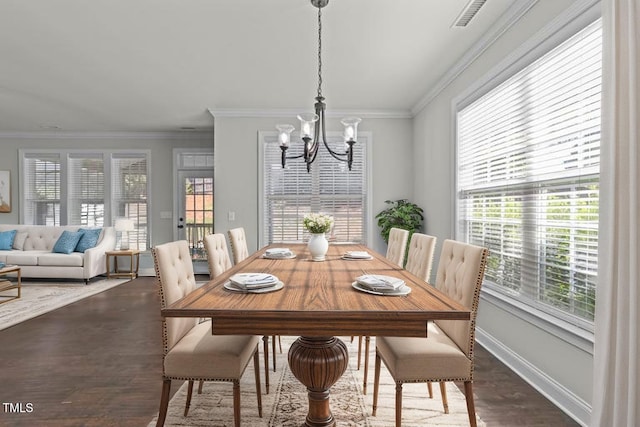 427 Cedar Pond Ct, Knightdale, NC 27545 - dining room featuring a chandelier, dark wood-style flooring, and crown molding