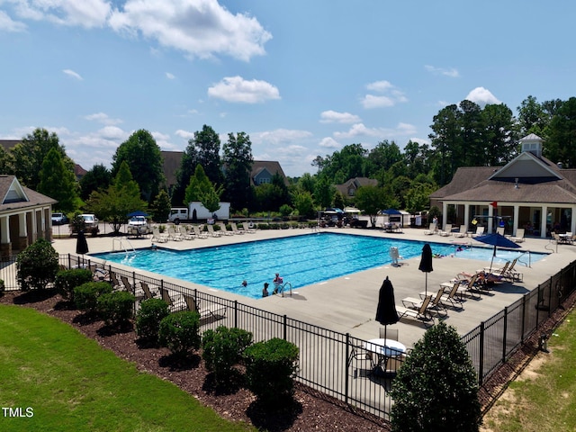 427 Cedar Pond Ct, Knightdale, NC 27545 - community pool featuring a patio and view of scattered trees