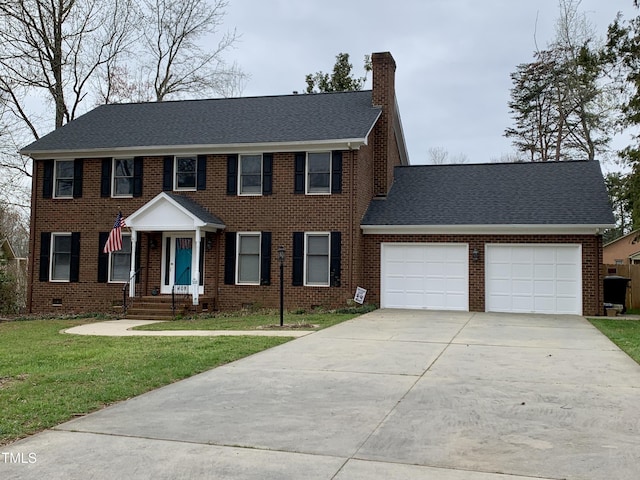 408 Greenfern Ct, Burlington, NC 27215 - colonial home featuring an attached garage, a chimney, driveway, a front yard, and brick siding