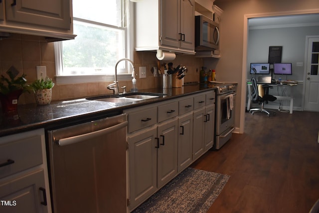 408 Greenfern Ct, Burlington, NC 27215 - kitchen featuring stainless steel appliances, dark countertops, crown molding, backsplash, and white cabinetry