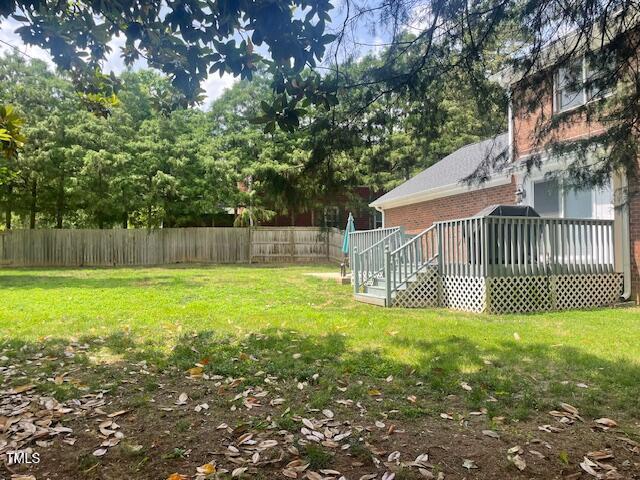 408 Greenfern Ct, Burlington, NC 27215 - fenced yard featuring a wooden deck