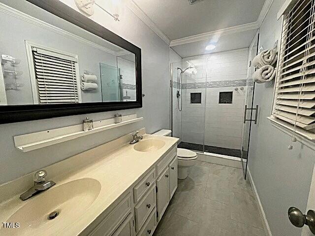 408 Greenfern Ct, Burlington, NC 27215 - full bathroom with ornamental molding, a shower stall, and double vanity