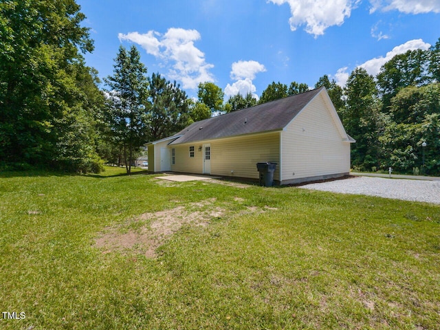 381 Gray Ghost Ln, Benson, NC 27504 - view of side of home featuring a patio area and a lawn