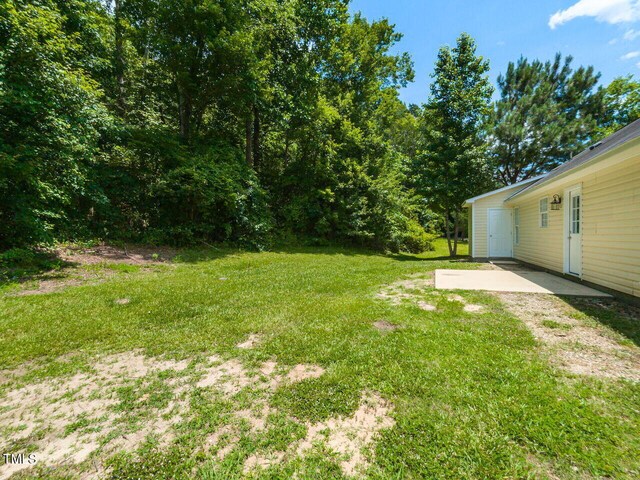 381 Gray Ghost Ln, Benson, NC 27504 - view of green lawn featuring a patio