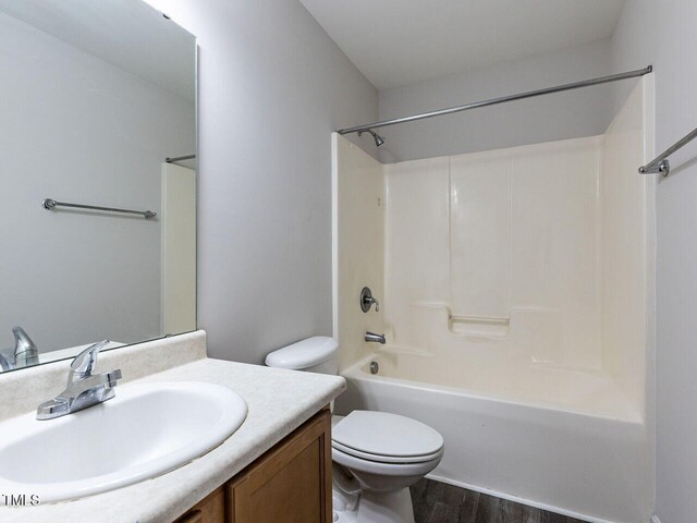 381 Gray Ghost Ln, Benson, NC 27504 - bathroom with vanity, wood finished floors, and shower / bath combination